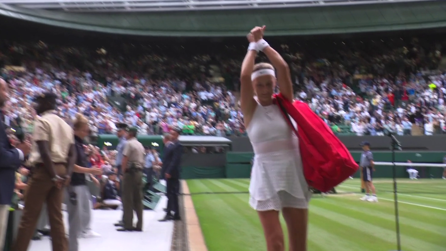 Victoria Azarenka raises her fists as if to signal they are cuffed after her loss to ELina Svitolina at Wimbledon.