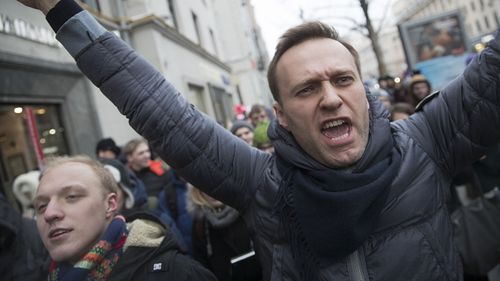 Russian opposition leader Alexei Navalny (centre) has been arrested in Moscow while walking with protesters, as protests take place across the country. (AP Photo/Evgeny Feldman)