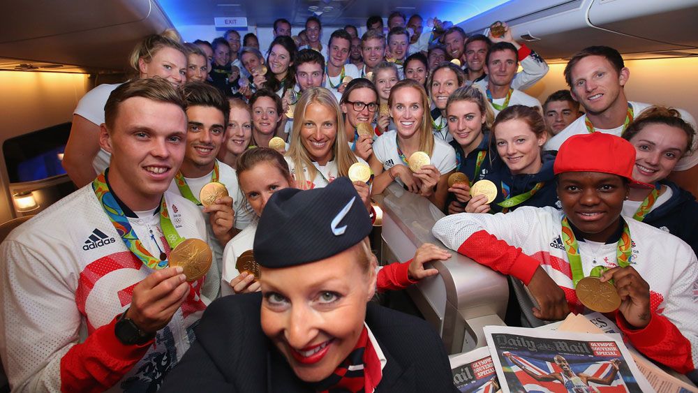 Team GB on board a British Airways flight home.