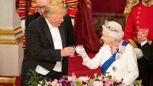 Donald Trump and the Queen toast each other at the royal banquet.