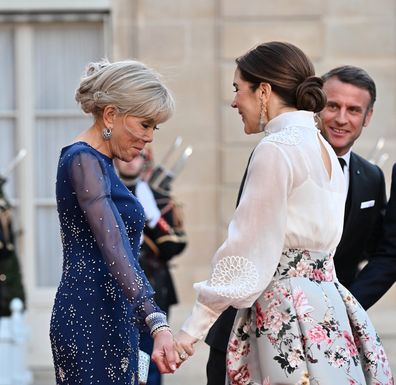 PARIS, FRANCE - MARCH 31: French President Emmanuel Macron (R), his wife Brigitte Macron (L) welcome King Frederik X (not seen) and Queen Mary (2nd R) of Denmark  at the Elysee Presidential Palace in Paris, France on March 31, 2025. (Photo by Mustafa Yalcin/Anadolu via Getty Images)