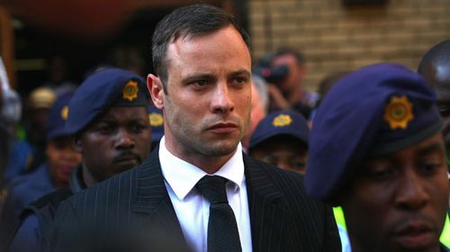 Oscar Pistorius leaves the High Court in Pretoria on his second day of sentencing. (AAP)