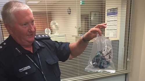 Inspector Simon Clemence with the underwear that sparked a 10-hour security scare in Mildura. (Twitter, @_EmilyWhite_)