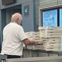 Pilot on delayed flight buys pizza for 150 stranded passengers