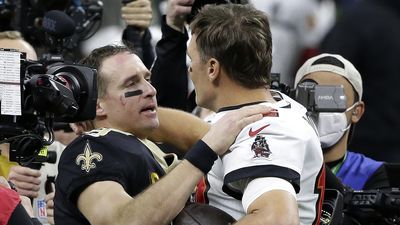 New Orleans Saints quarterback Drew Brees embraces Tampa Bay Buccaneers quarterback Tom Brady after what is thought will be Brees' final NFL game.