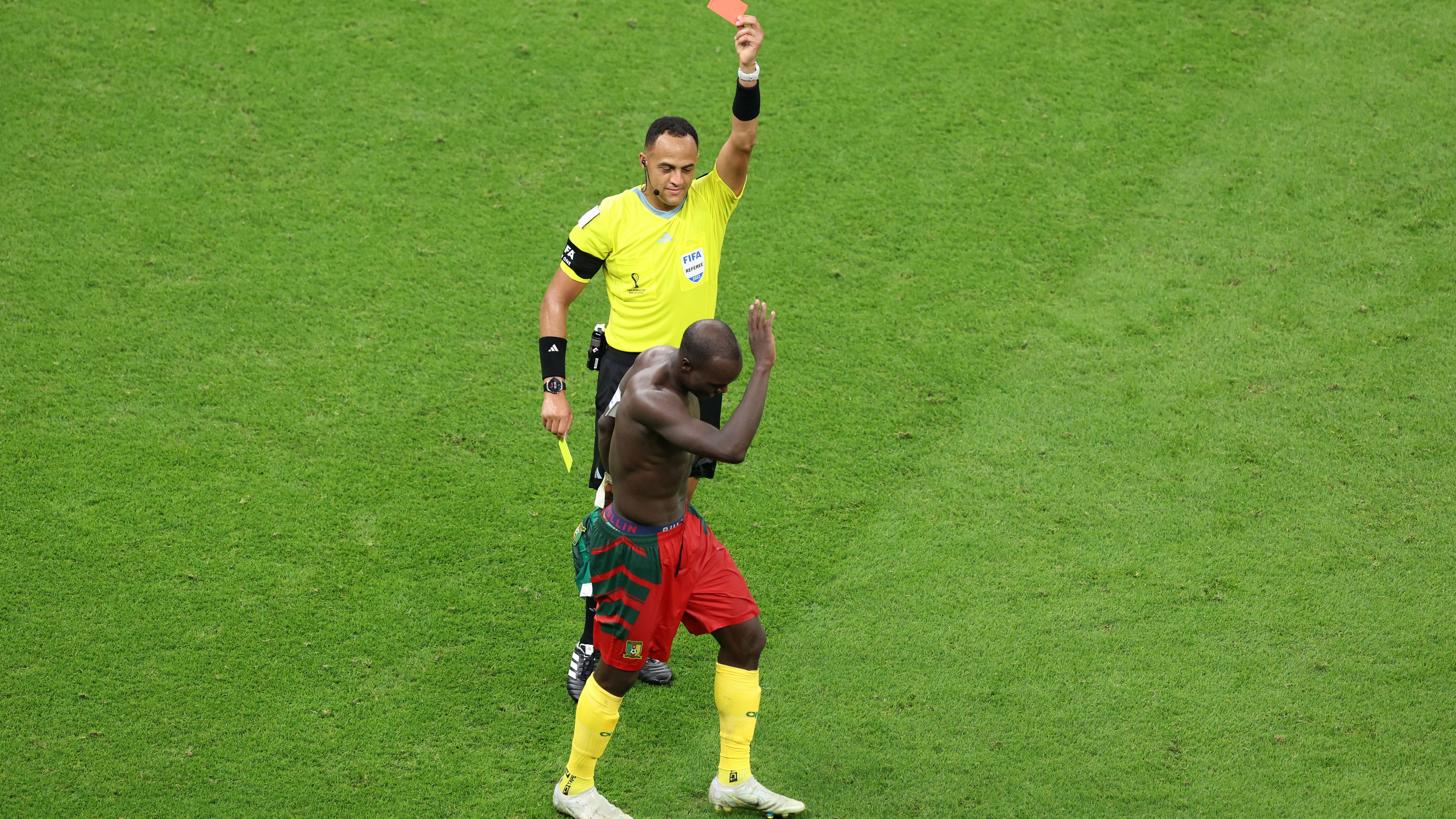 Referee Ismail Elfath shows a red card to Vincent Aboubakar of Cameroon after they scored their sides first goal during the FIFA World Cup Qatar 2022 Group G match between Cameroon and Brazil at Lusail Stadium on December 02, 2022 in Lusail City, Qatar. (Photo by Tim Nwachukwu/Getty Images)