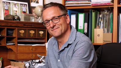 Dr Michael Mosley sitting in an office
