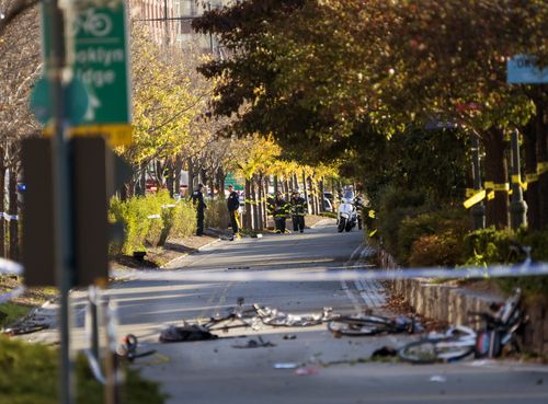 Bicycles and debris lay on a bike path after a motorist drove onto the path near the World Trade Center memorial. (AP)