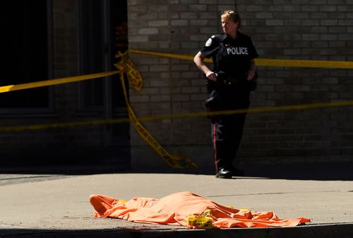 Bodies were covered in orange blankets waiting to be examined by the coroner. 