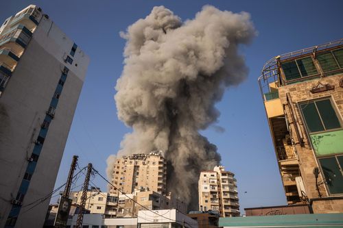 Smoke rises after an Israeli airstrike on November 1, 2024 in Tyre, Lebanon. In recent weeks, Israeli airstrikes have become more frequent in this southern Lebanese city, which was previously a refuge for displaced people from areas farther south near the border with Israel. In some instances, the Israeli army has issued evacuation orders for parts of the city prior to bombing. (Photo by Ed Ram/Getty Images)