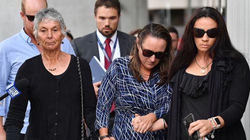 The family and friends of murder victim Greg Dufty are seen leaving the Brisbane Supreme Court.