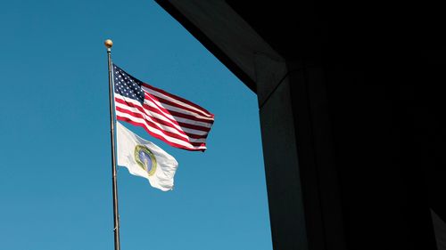 Flags outside the Department of Energy. Trump officials fired more than 300 probationary employees at the NNSA Thursday, then rescinded those terminations on Friday.