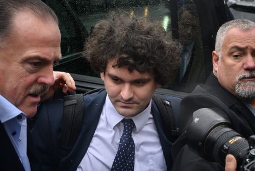 Former FTX chief executive Sam Bankman-Fried (centre) arrives to enter a plea before US District Judge Lewis Kaplan in the Manhattan federal court, New York, January 3, 2023.