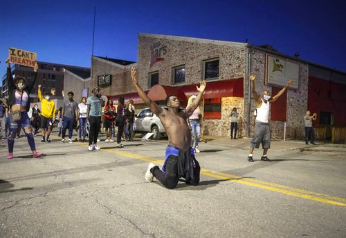 In this May 29 photo, Marcus Lavon of Des Moines, Iowa. raises his hands during a protest in Des Moines. Protests have been erupting all over the country after George Floyd died earlier this week in police custody in Minneapolis. 