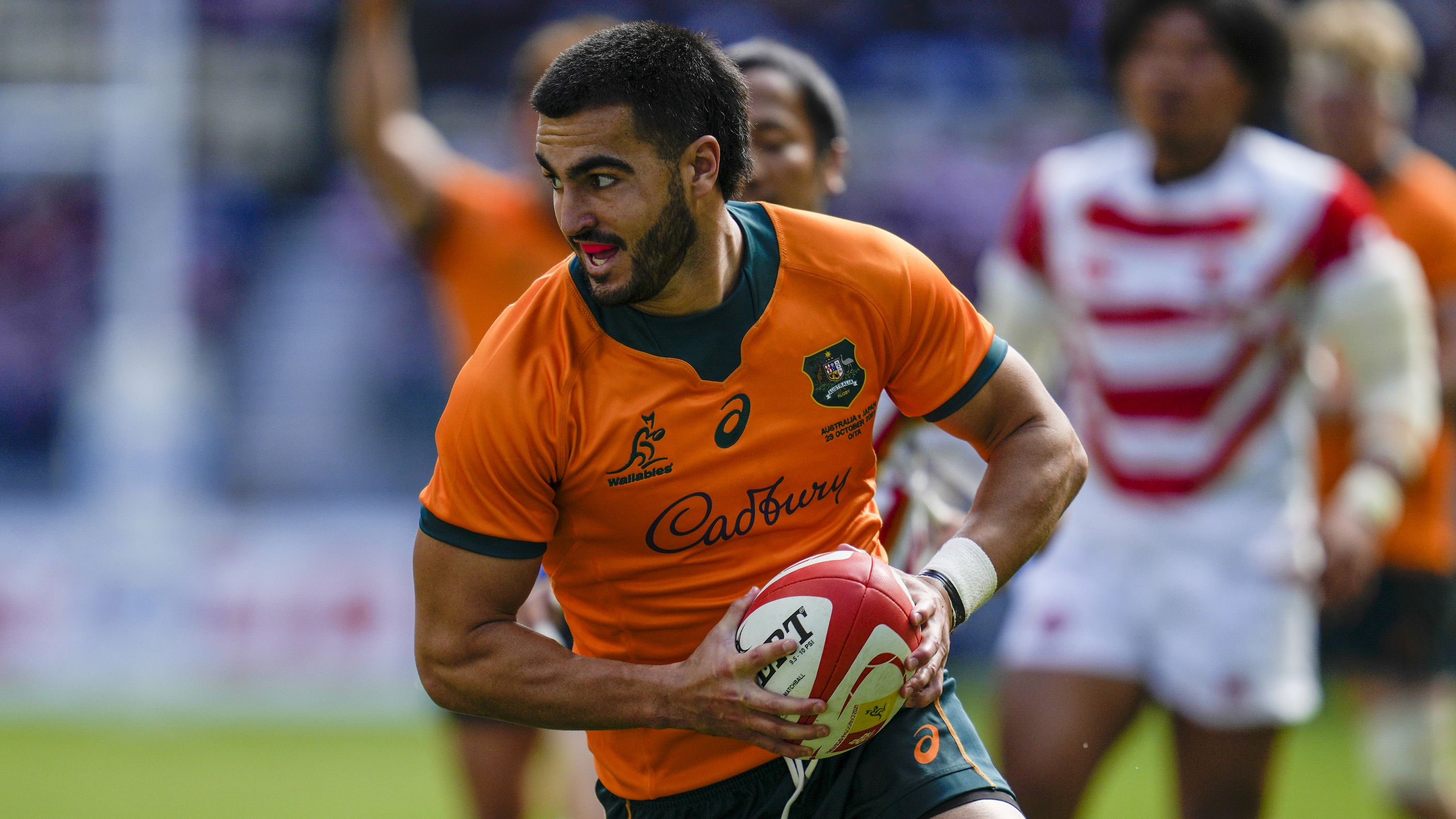 Australia&#x27;s Tom Wright runs in to score his teams first try during the rugby international between the Wallabies and Japan.