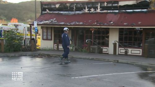 The fire destoryed three shops.