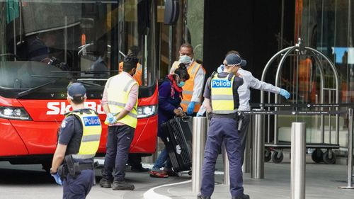 Overseas travellers arrive at Crown for quarantine. 