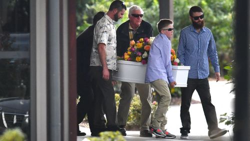 A small white coffin is carried from the chapel. Picture: AAP