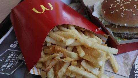 A 13-year-old boy has been charged with assault after being accused of firing a chip through a straw at a McDonald's in West London. 