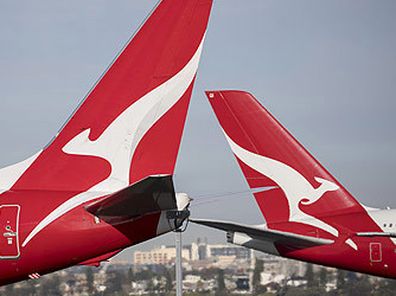Qantas jet tails at Sydney Airport (Getty)