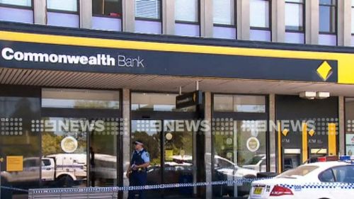 The Commonwealth Bank in Chester Hill has been taped off while police investigate. (9NEWS)
