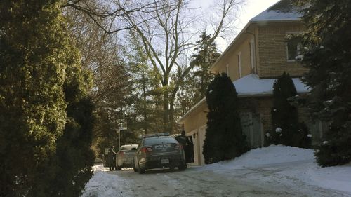 The house where the couple were found dead in Toronto. Now the family court case has taken a new twist.