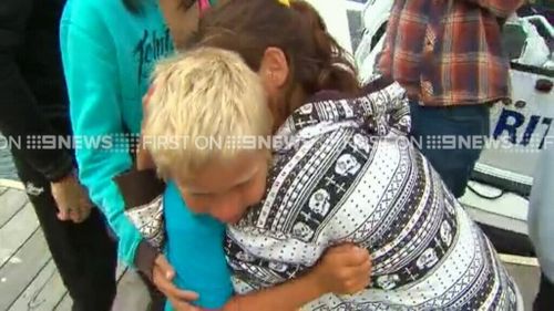 Tearful scenes at the dock this afternoon. (9NEWS)
