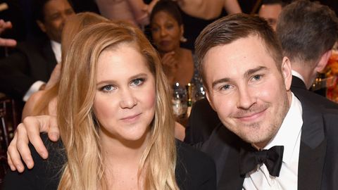 Amy Schumer and Ben Hanisch attend the 74th Annual Golden Globe Awards.