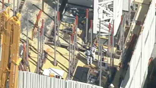 A man has died after falling off a crane in North Sydney. (9NEWS)