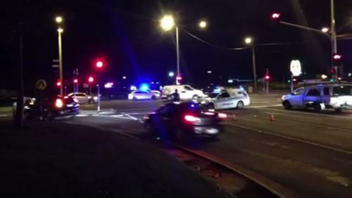 Police remained late into the night at Heatherton Road, Endeavour Hills, after two officers were stabbed and a man shot dead. (9News)