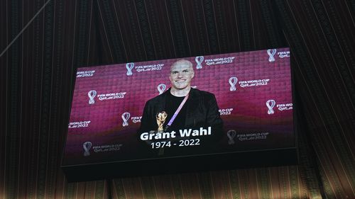 A tribute to journalist Grant Wahl is shown on a screen before the World Cup quarterfinal soccer match between England and France, at the Al Bayt Stadium in Al Khor, Qatar, Saturday, December 10, 2022.