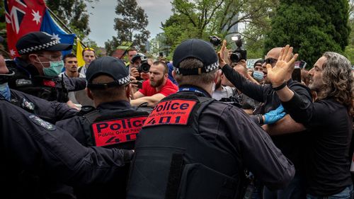 Protesters and members of Victoria Police clash on October 23, 2020 in Melbourne, Australia