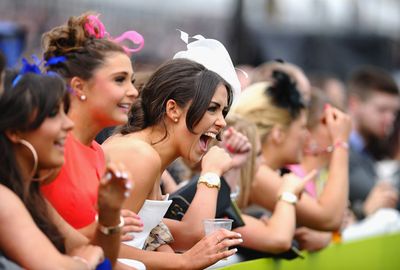 Fans cheered on the horses in the jumps action. (Getty)