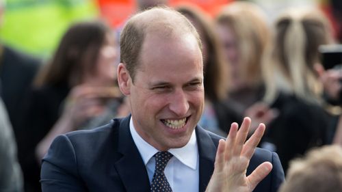 Prince William was swamped by crowds of adoring fans while formally opening a new trauma centre in north-west England. (AFP)