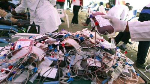 A medic organises blood bags for the victims of the attack.