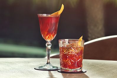 Negroni classic and Negroni sbagliato coctails, on the table