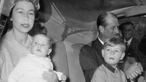 Queen Returns from Balmoral. The Queen and the Duke of Edinburgh, with Prince Edward and Prince Andrew, their youngest children, leave Euston Station by car after arriving back in London from Balmoral today, October 2, at the end of their summer holiday in Scotland. The Queen and her husband leave for a tour of Canada in four days' time. Princes Edward and Andrew will be two of the Royal youngsters gathered at Sandringham with their parents this Christmas. In this photograph, taken in October, t