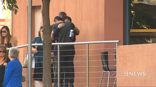 Mrs Cheng was hugged and comforted at the scene. (9NEWS)