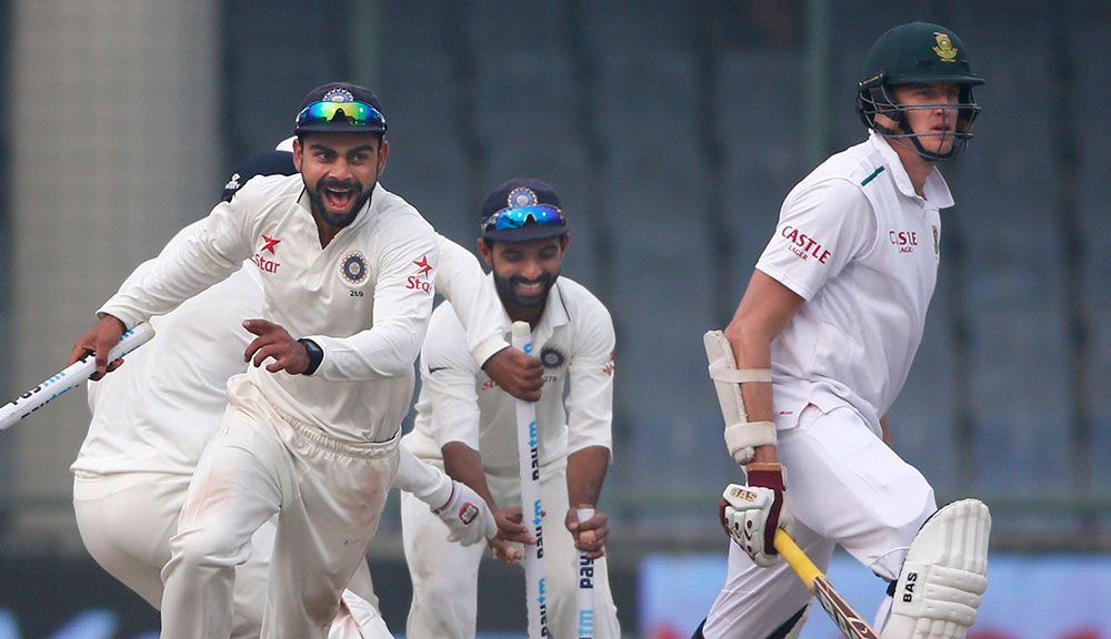 Virat Kohli celebrates the Test win after Ravi Ashwin removed Morne Morkel. (AAP)