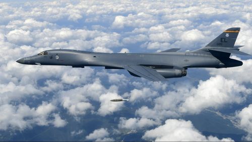a US Air Force B-1B bomber drops a bomb as it flies over the Korean Peninsula during a joint drills, South Korea. (AAP, South Korea Defense Ministry)