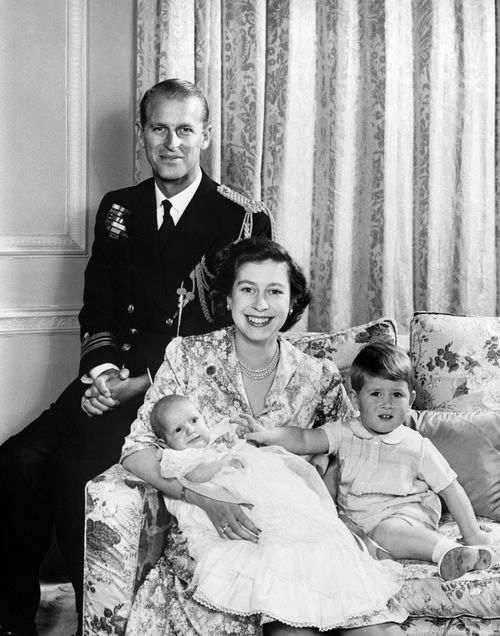Queen Elizabeth poses for a family portrait with a young Charles and Anne