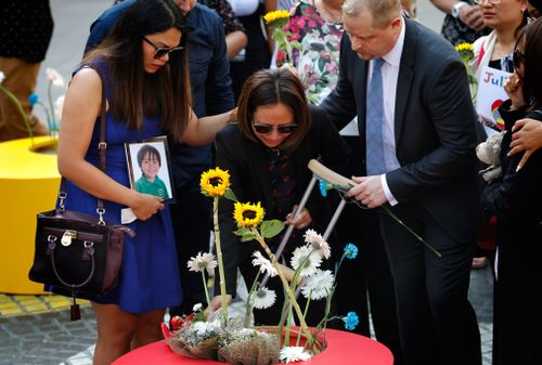 Sydney parents Jom and Andrew Cadman made the emotional journey from Australia, to lay flowers for their seven-year-old son, Julian. 