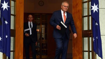 Prime Minister Scott Morrison arrives with Chief Medical Officer Paul Kelly to brief the media on today&#x27;s National Cabinet meeting.