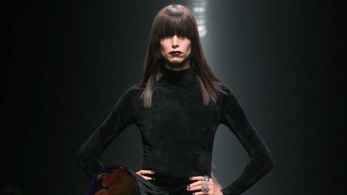 Model on the runway at the Versace Fall RTW 2025 fashion show as part of Milan Fashion Week.