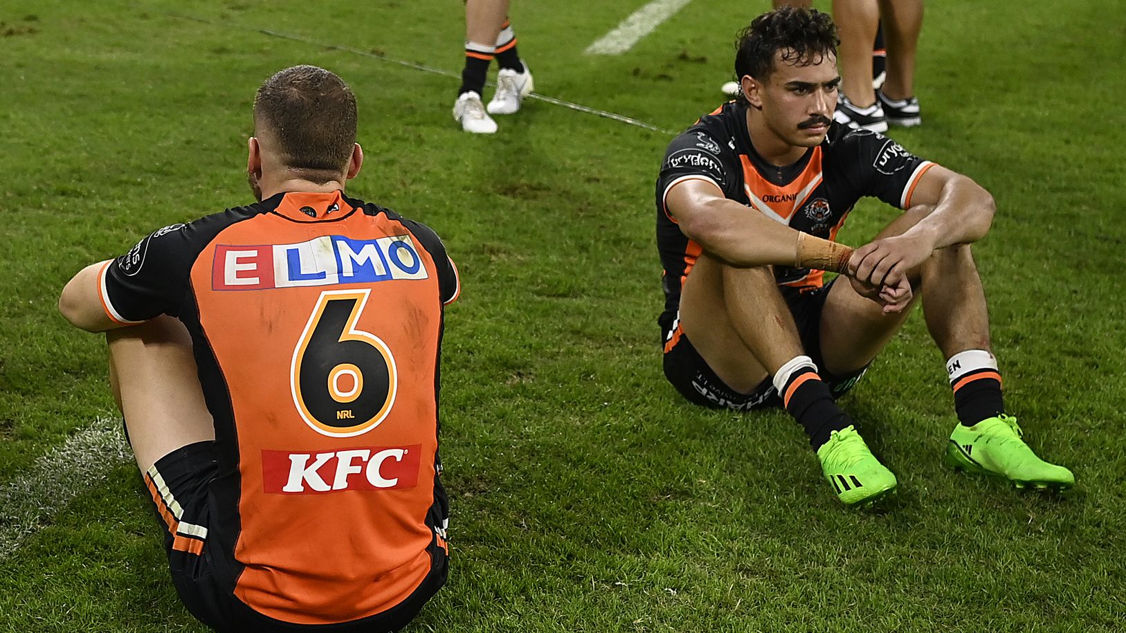 The Tigers look dejected after losing the round 19 match against the Cowboys due to a strange Bunker decision.