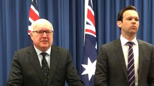 George Brandis and Matt Canavan front the media today. (AAP)