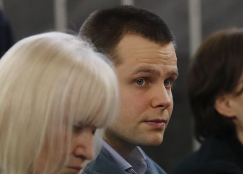 Lukasz Herba, right, sits with his lawyer Katia Kolakowska in court. (AAP)