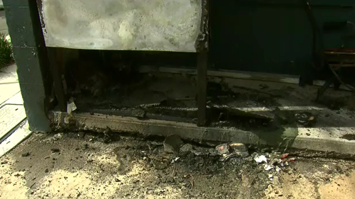 The fire on the verandah of the townhouse was extinguished by firefighters who arrived soon after. (9NEWS)