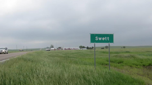 A bullet-riddled sign marks the Swett town boundary. (Facebook / Stacie Montgomery)
