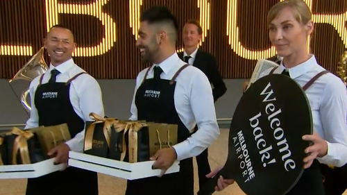 Passengers welcomed as Victoria's first international tourist flight touches down at Melbourne Airport. 